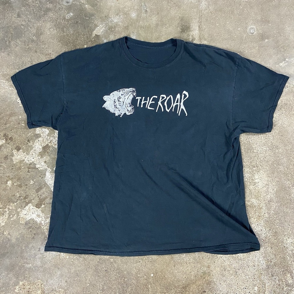 Vintage "The Roar" T-Shirt Size XL Black Crewneck Short Sleeve "We Have Issues"